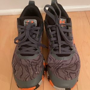 Under Armour sneakers. Size 5.5 worn for one season. Excellent condition. Grey.